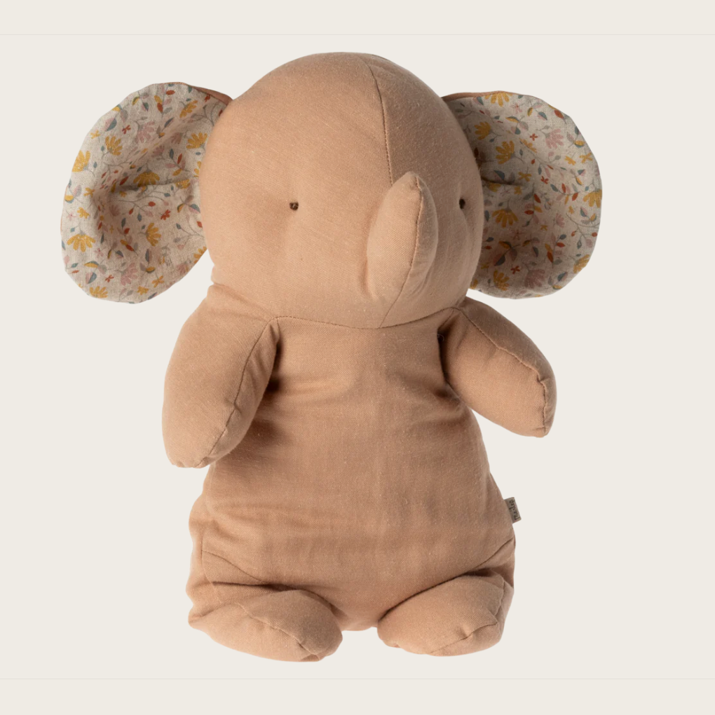 A plush toy elephant with a rose-colored body and floral patterned ears, made of soft fabric.