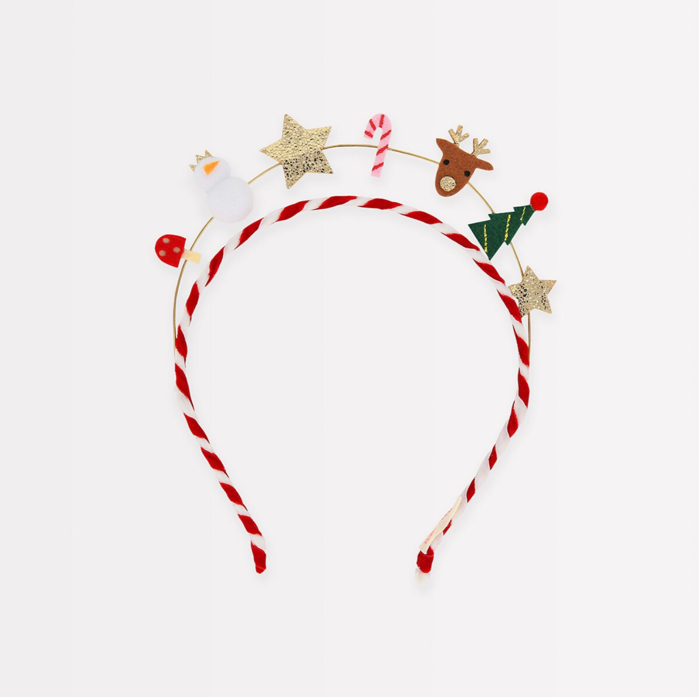 A red and white striped velvet headband with a variety of festive icons including a mushroom, snowman, stars, candy cane, reindeer, and Christmas tree, attached to it.
