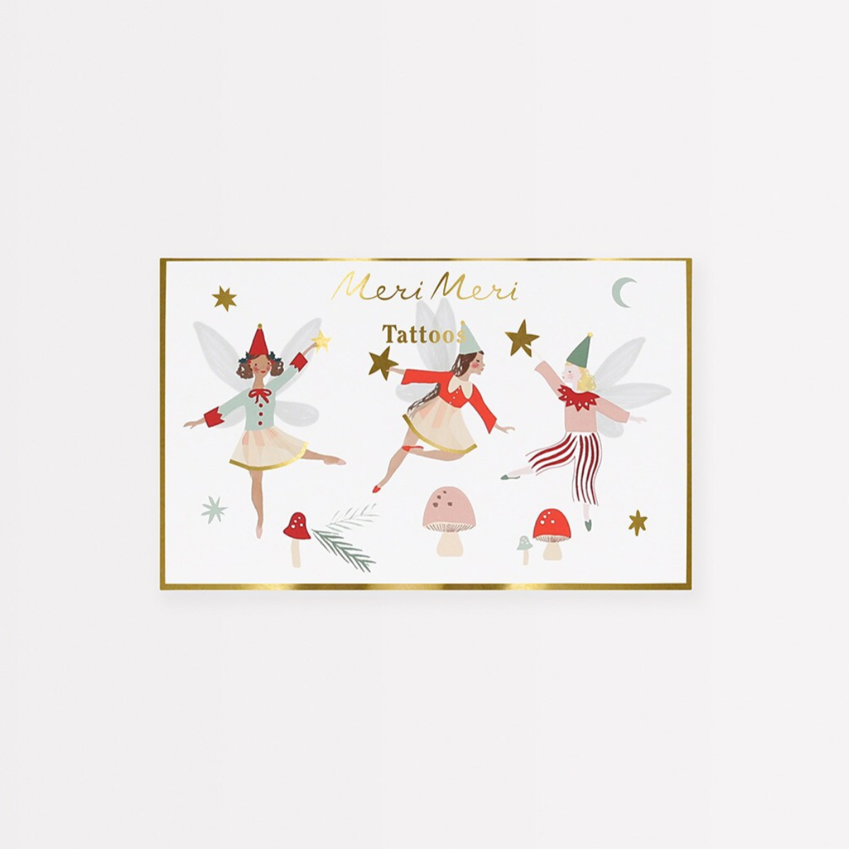 Packaging of Fairy Temporary Tattoos featuring illustrations of fairies and mushrooms with shiny gold foil details on a white background.