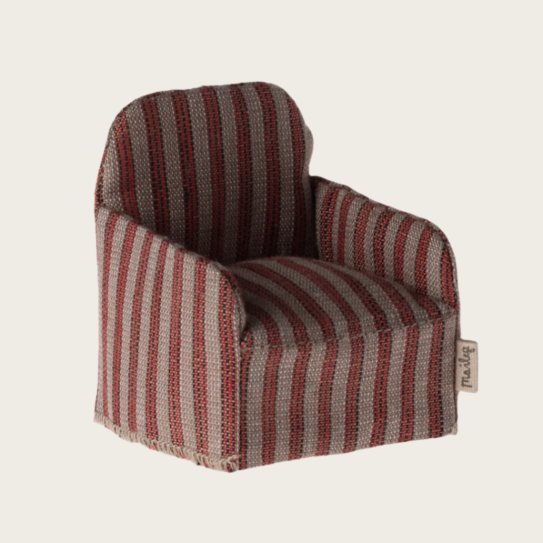 A small striped fabric chair for toy figures, with a red and white striped pattern.