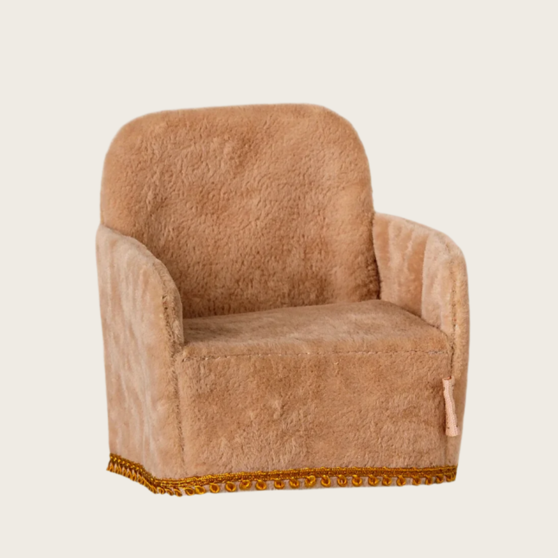 A small beige folding chair for dolls, with a plush texture and gold trim at the bottom.