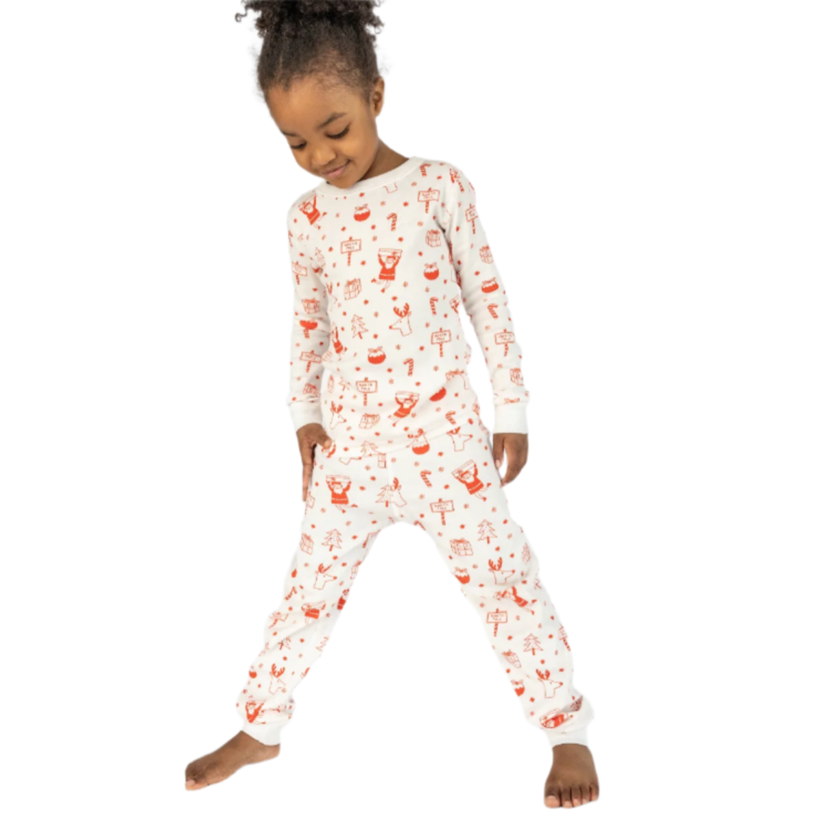 Child wearing a white onesie with red floral patterns on a light gray background