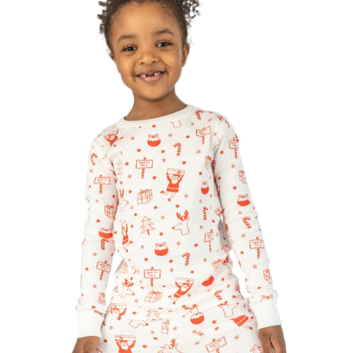 Child wearing a white long-sleeve shirt with red and orange patterns on a white background