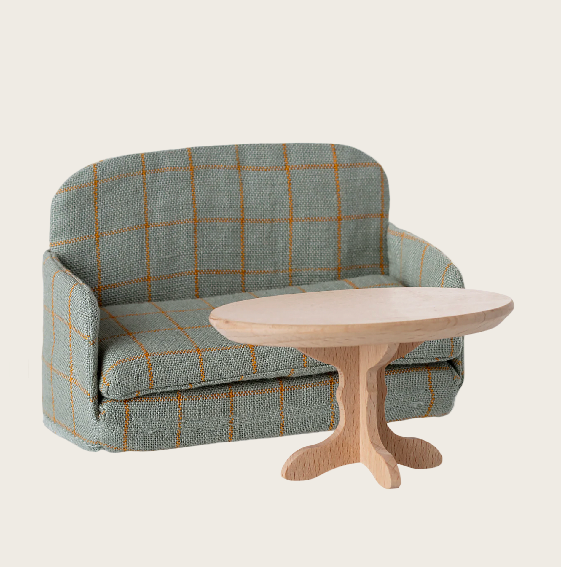 Plaid-patterned sofa with a wooden table on a computer screen