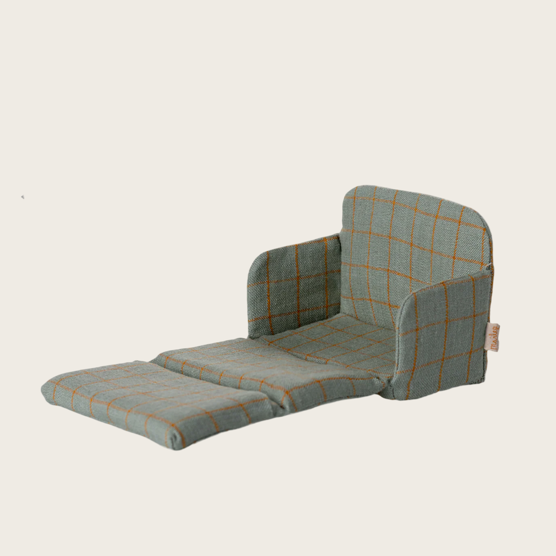 Plaid-patterned chair on a beige background