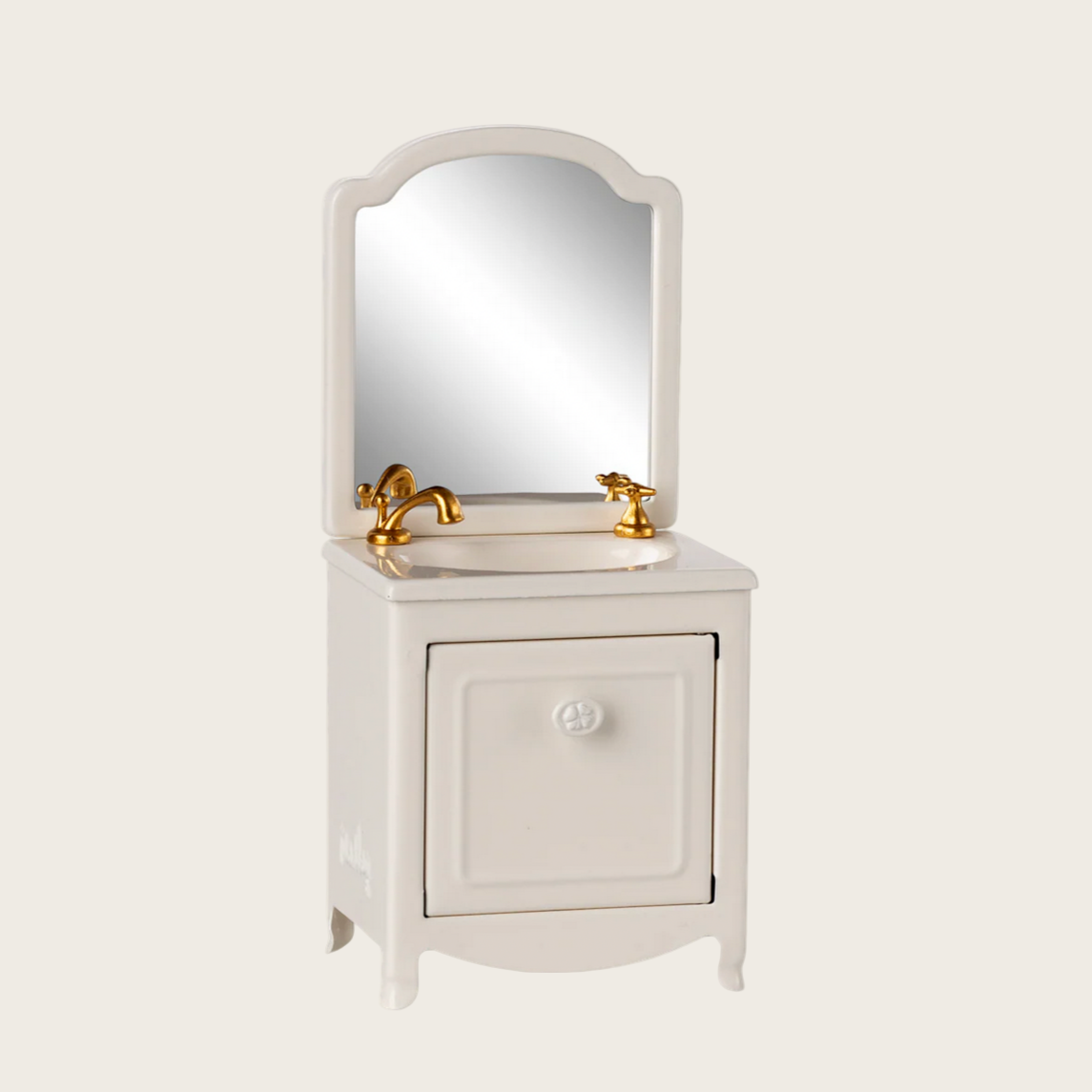 White bathroom vanity with mirror and gold fixtures on a white background