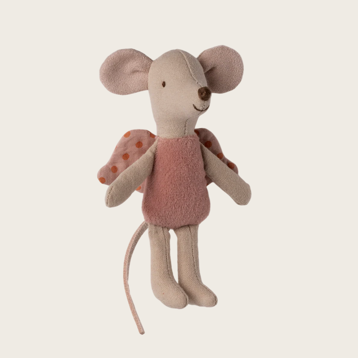 Stuffed toy mouse with a pink dress on a light gray background