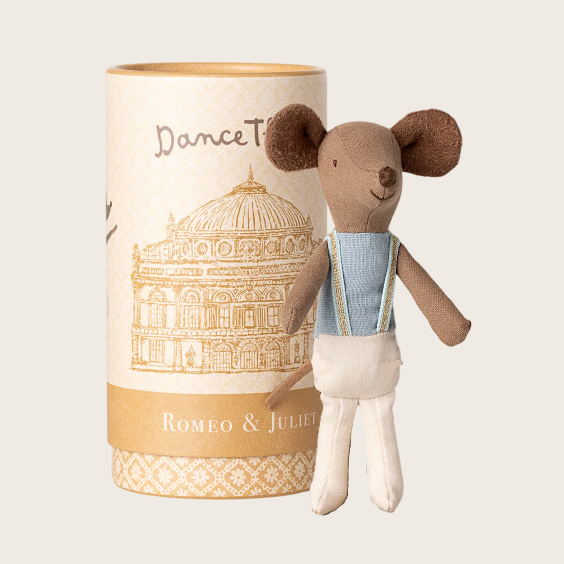 Stuffed mouse toy with a cylindrical packaging featuring architectural design and text.