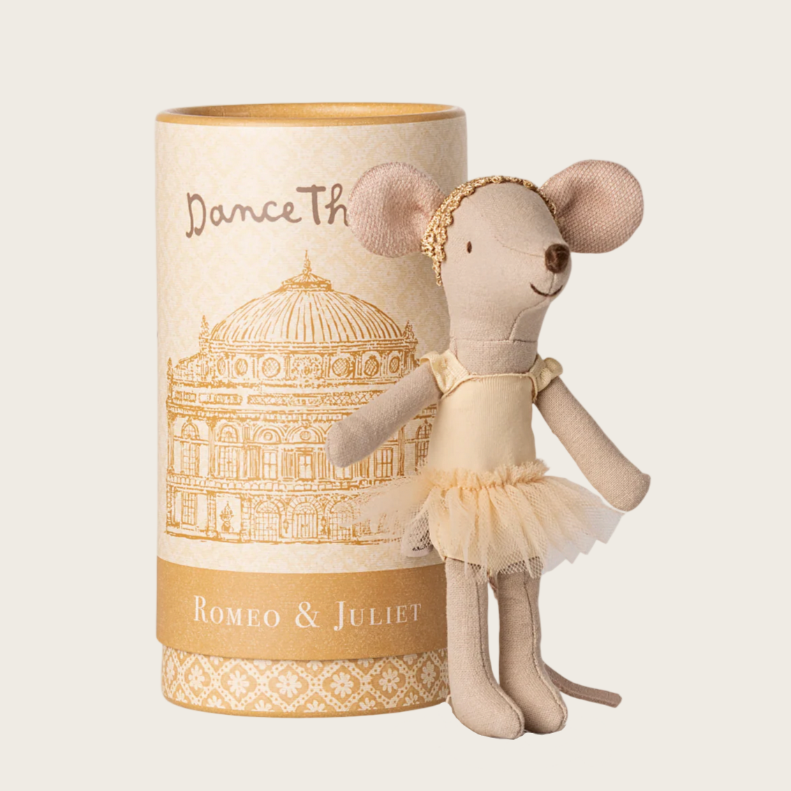 Stuffed mouse toy in a ballet outfit next to a cylindrical packaging with 'Dance Th' and 'Romeo & Juliet' text.
