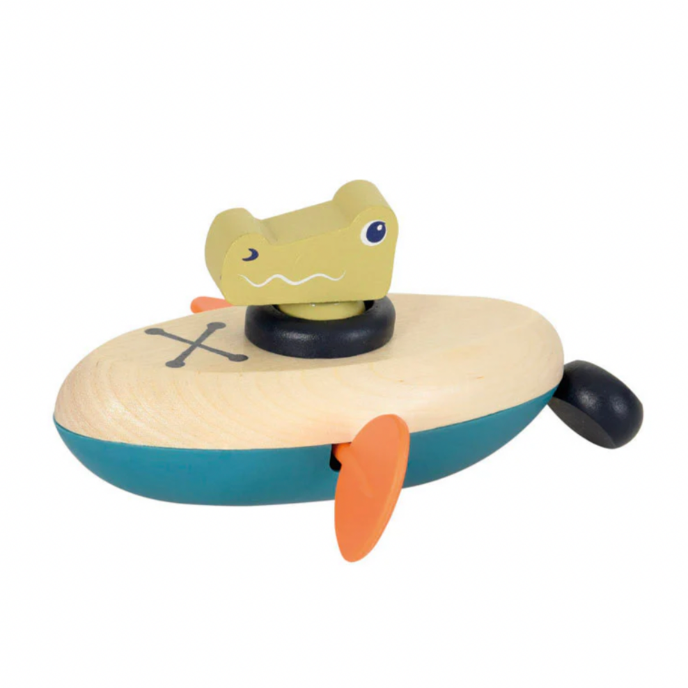 Toy alligator on a boat with a white background