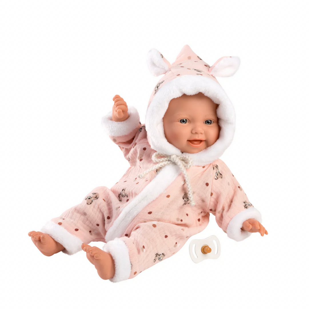 Baby doll in a pink outfit with a hood on a white background
