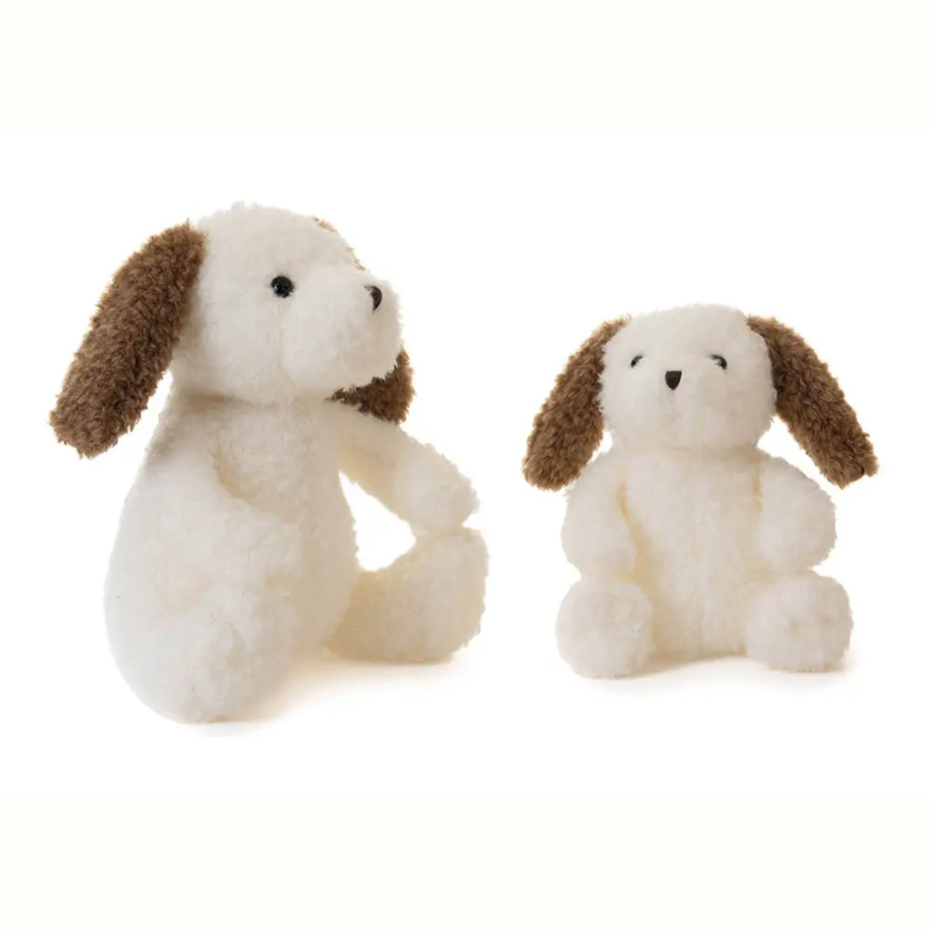 Two small plush dogs with brown ears on a white background