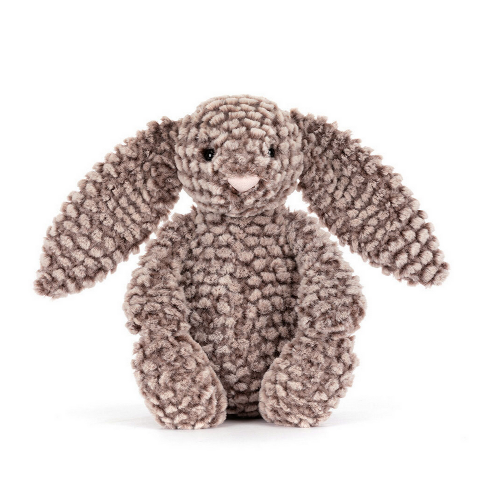 Stuffed bunny toy with textured fur on a white background