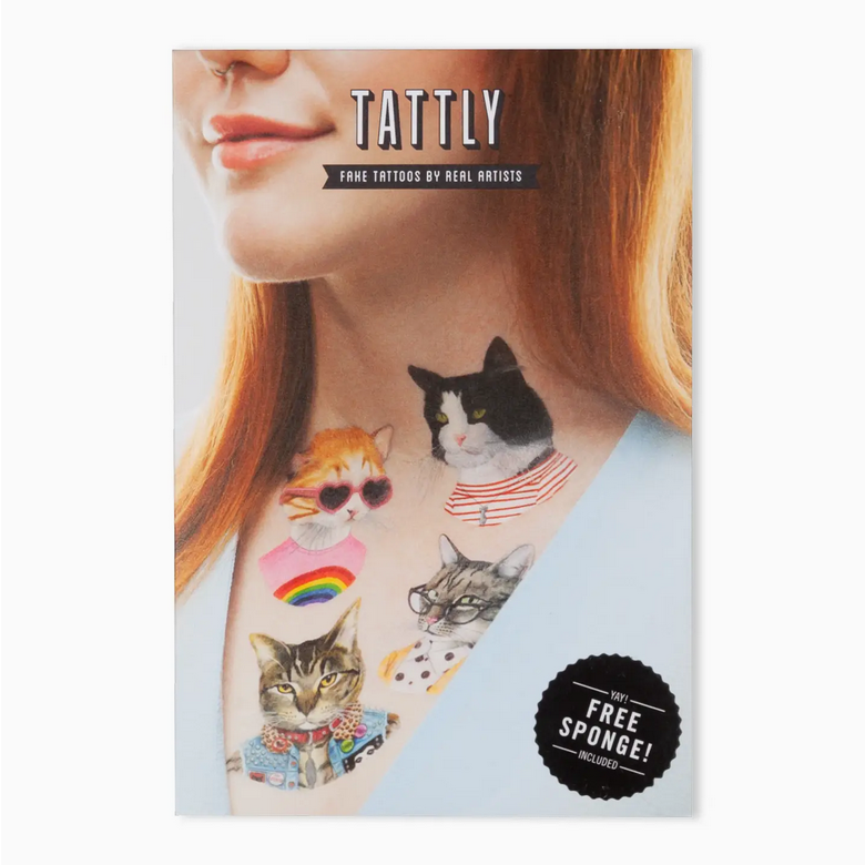 Tattly tattoo book with cat-themed tattoos on a person's arm, featuring the Tattly brand.