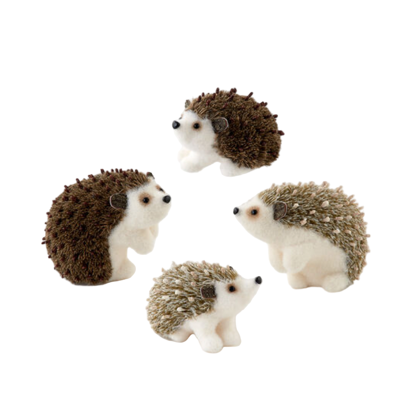 Four hedgehog figurines on a white background