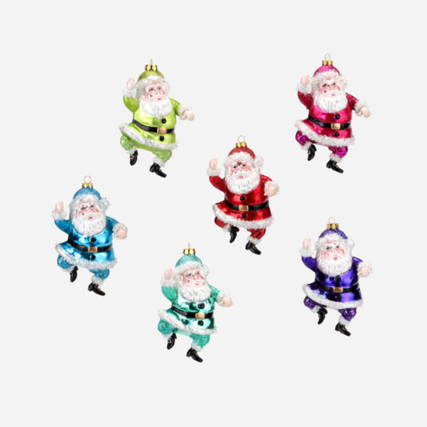 Set of colorful Santa Claus figurines on a white background