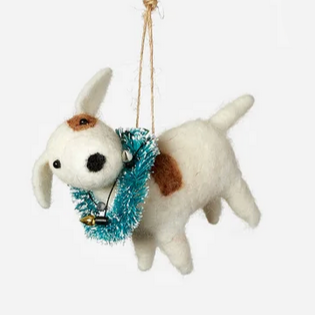 Dog-shaped Christmas ornament with a blue wreath on a white background