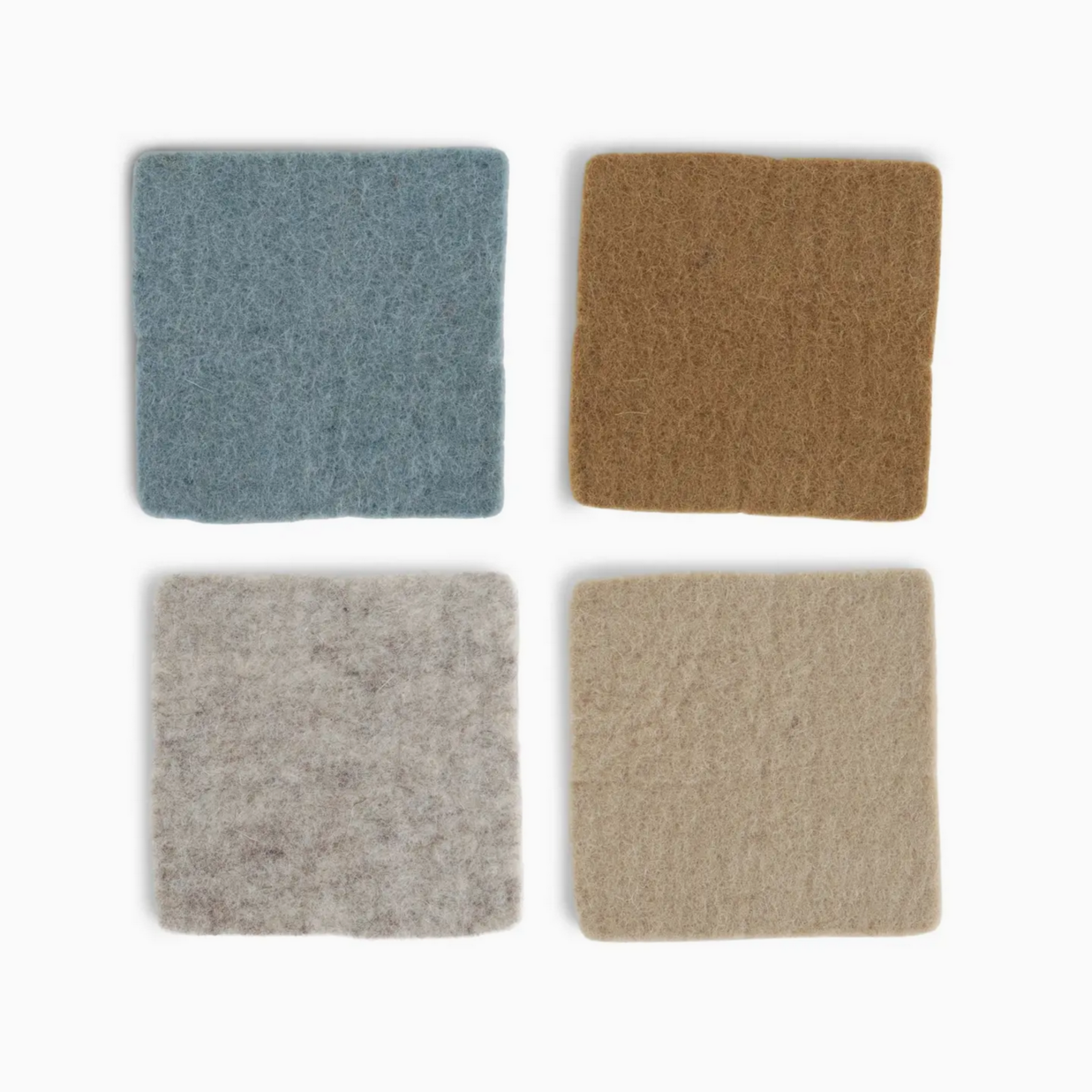 Four square samples of different carpet colors on a white background
