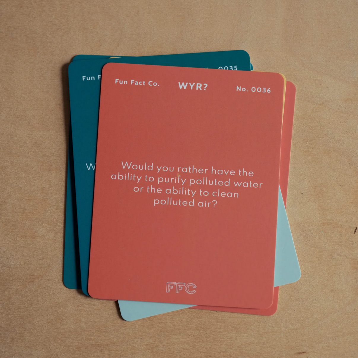 Stack of question cards with text on a brown background