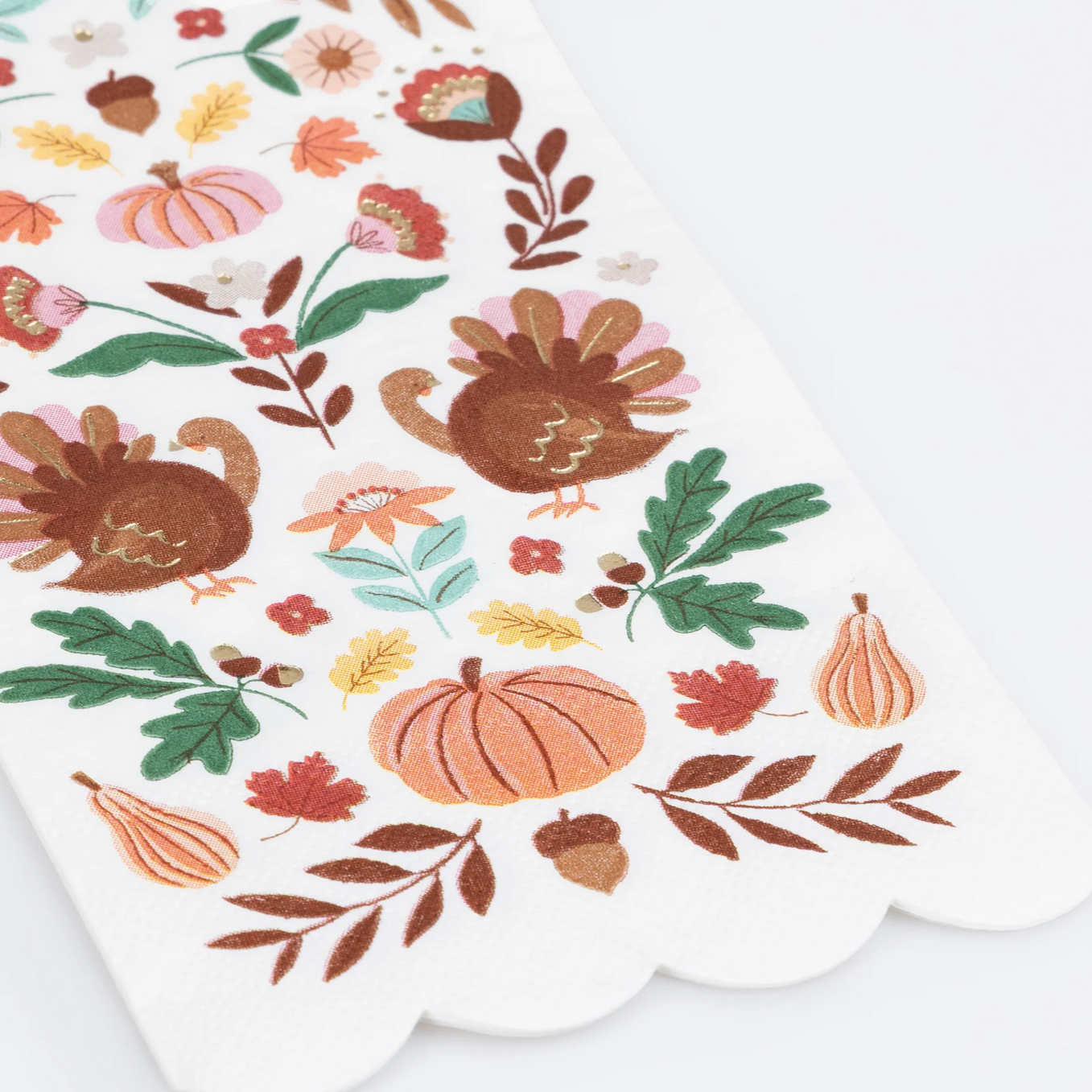 Decorative paper napkin with autumn-themed illustrations including turkeys, pumpkins, and leaves on a white background.
