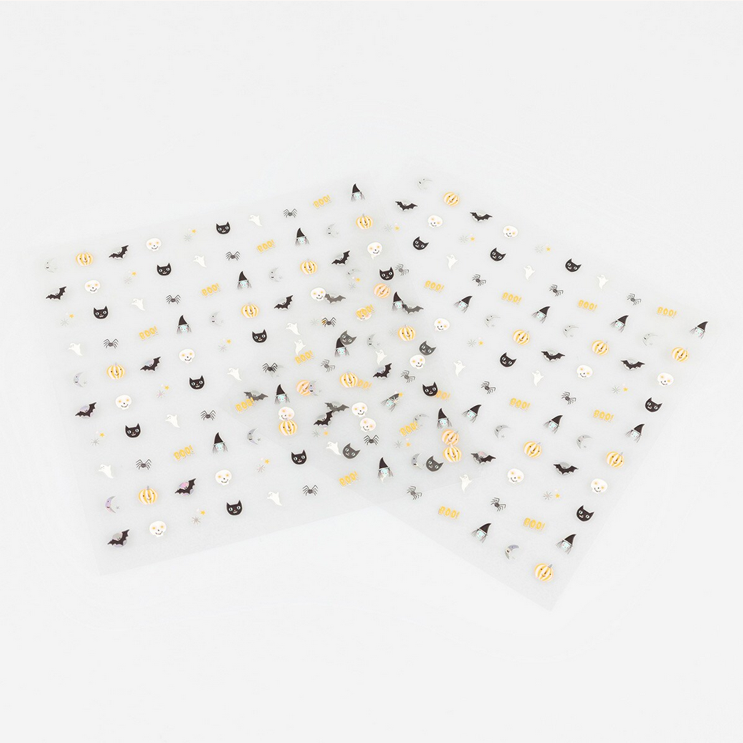 Halloween-themed confetti on a white background
