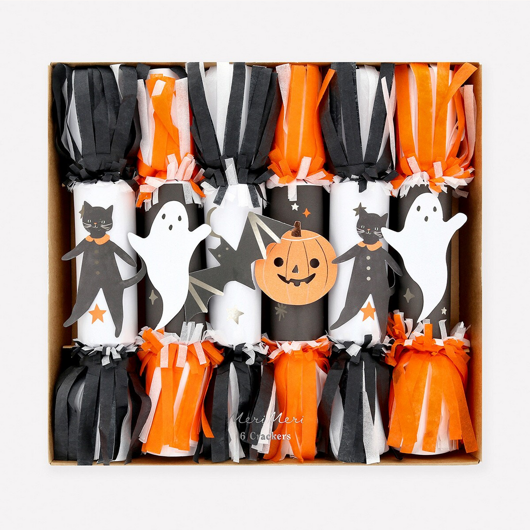 Box of Halloween-themed cracker decorations with ghosts, cats, and pumpkins.