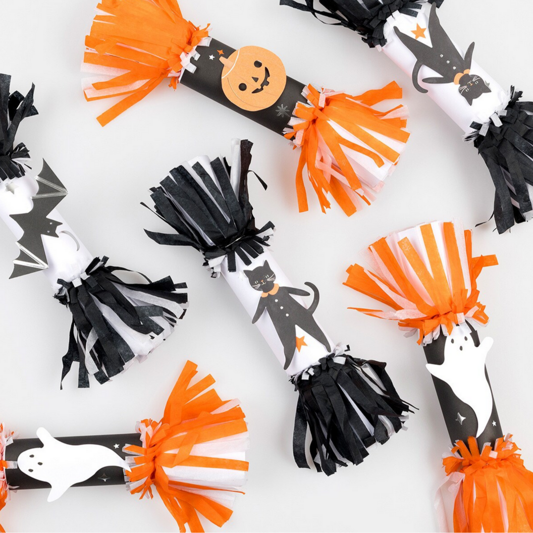 Halloween-themed pom-pom decorations on a white background