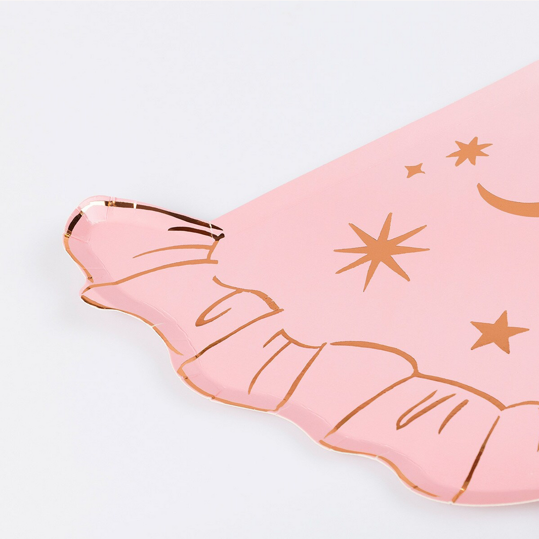 Pink phone case with gold star and moon designs on a light gray background