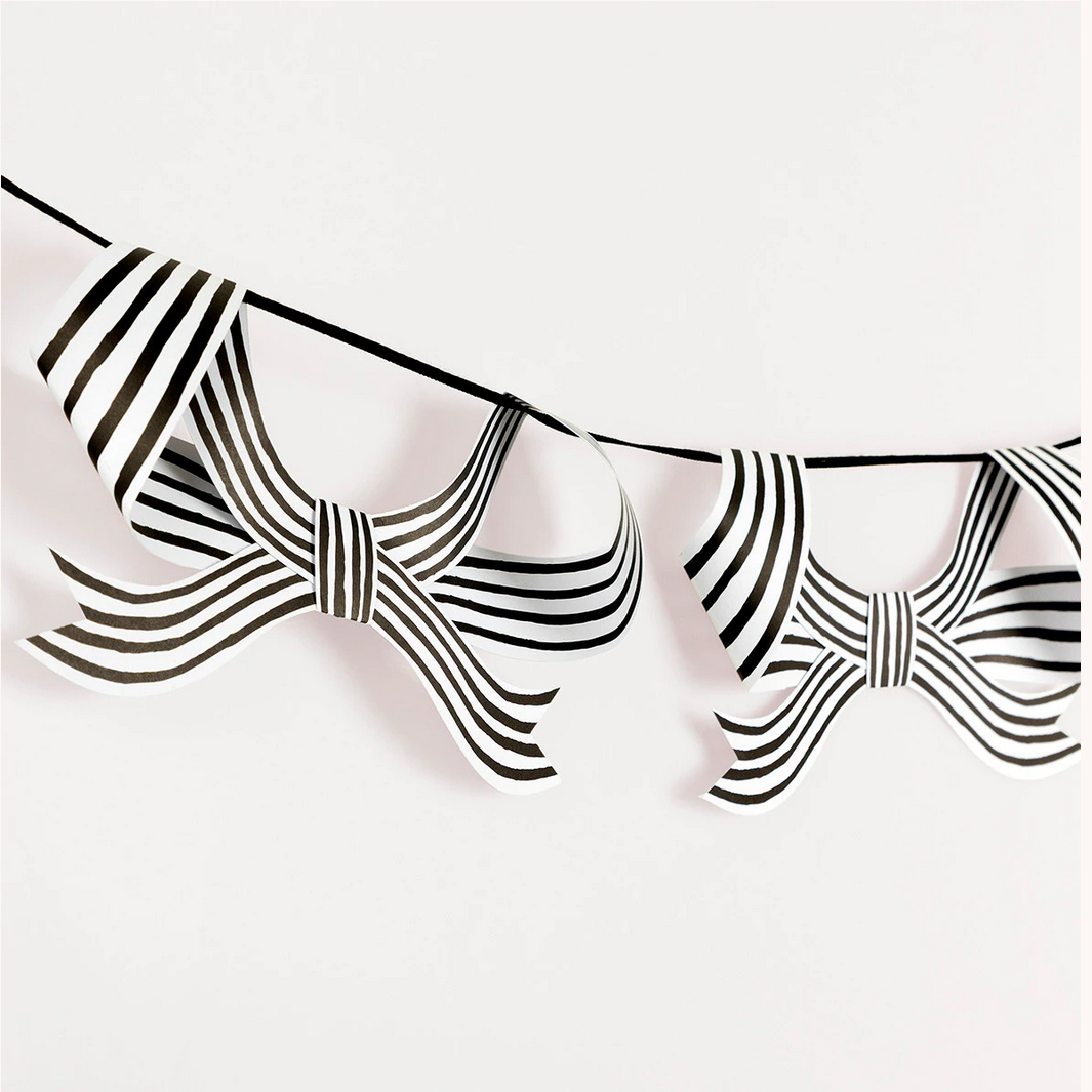 Black and white striped bow tie on a white background