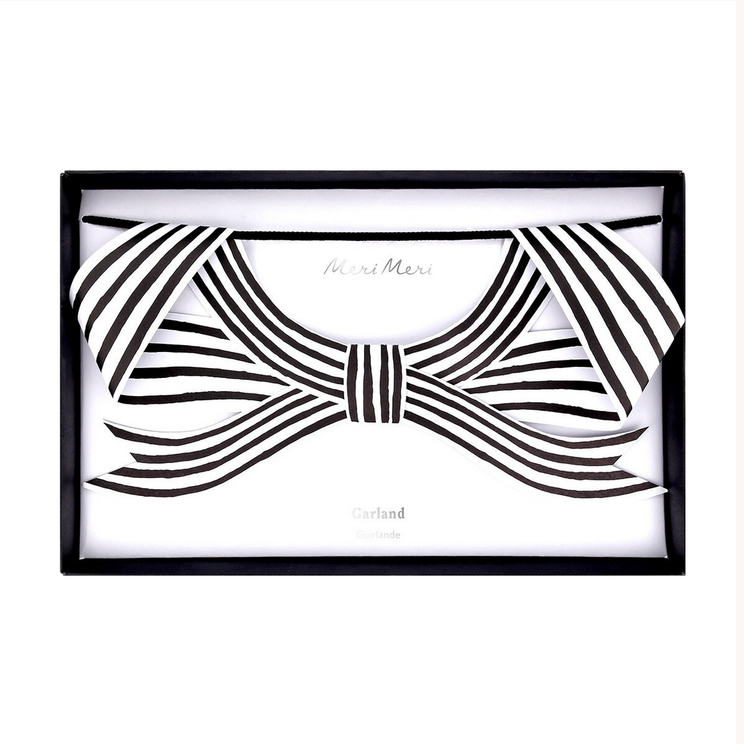 Black and white bow design with 'Meri Meri' branding on a white background