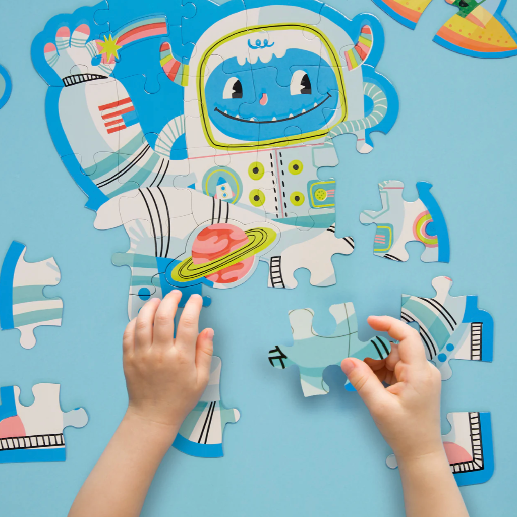 Children's puzzle with an astronaut design on a blue background