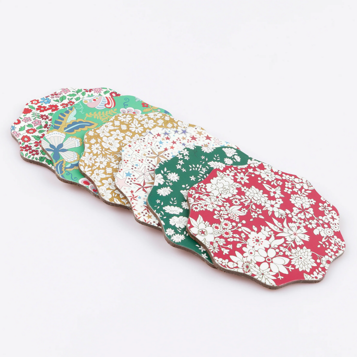 Set of floral-patterned coasters on a white background