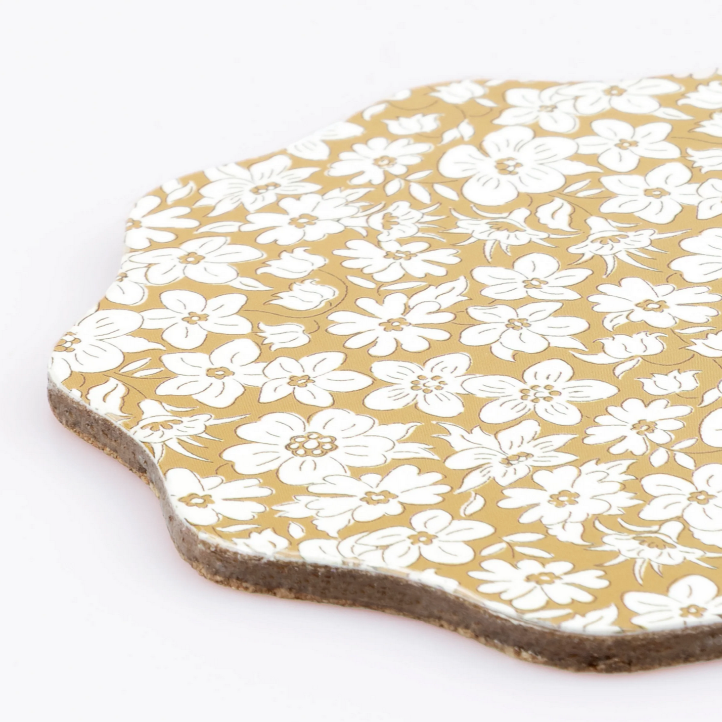 Floral-patterned coaster on a white background