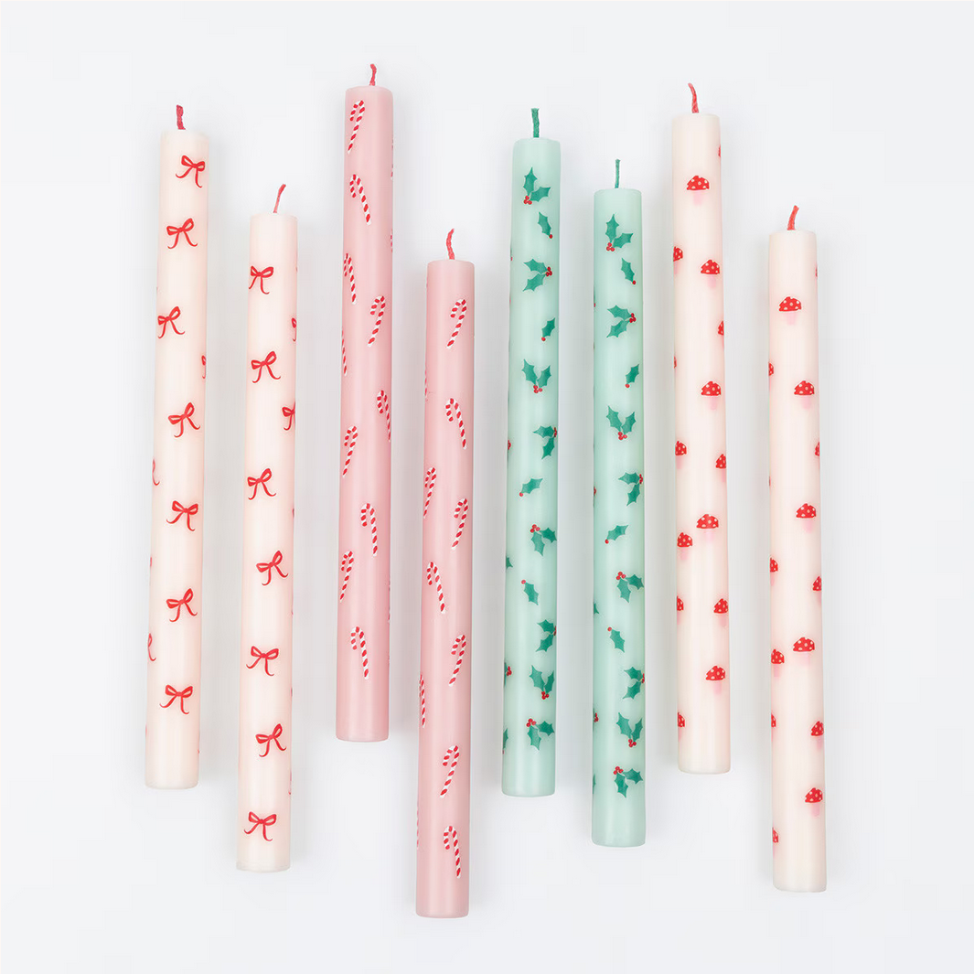 Set of candles with decorative patterns on a white background