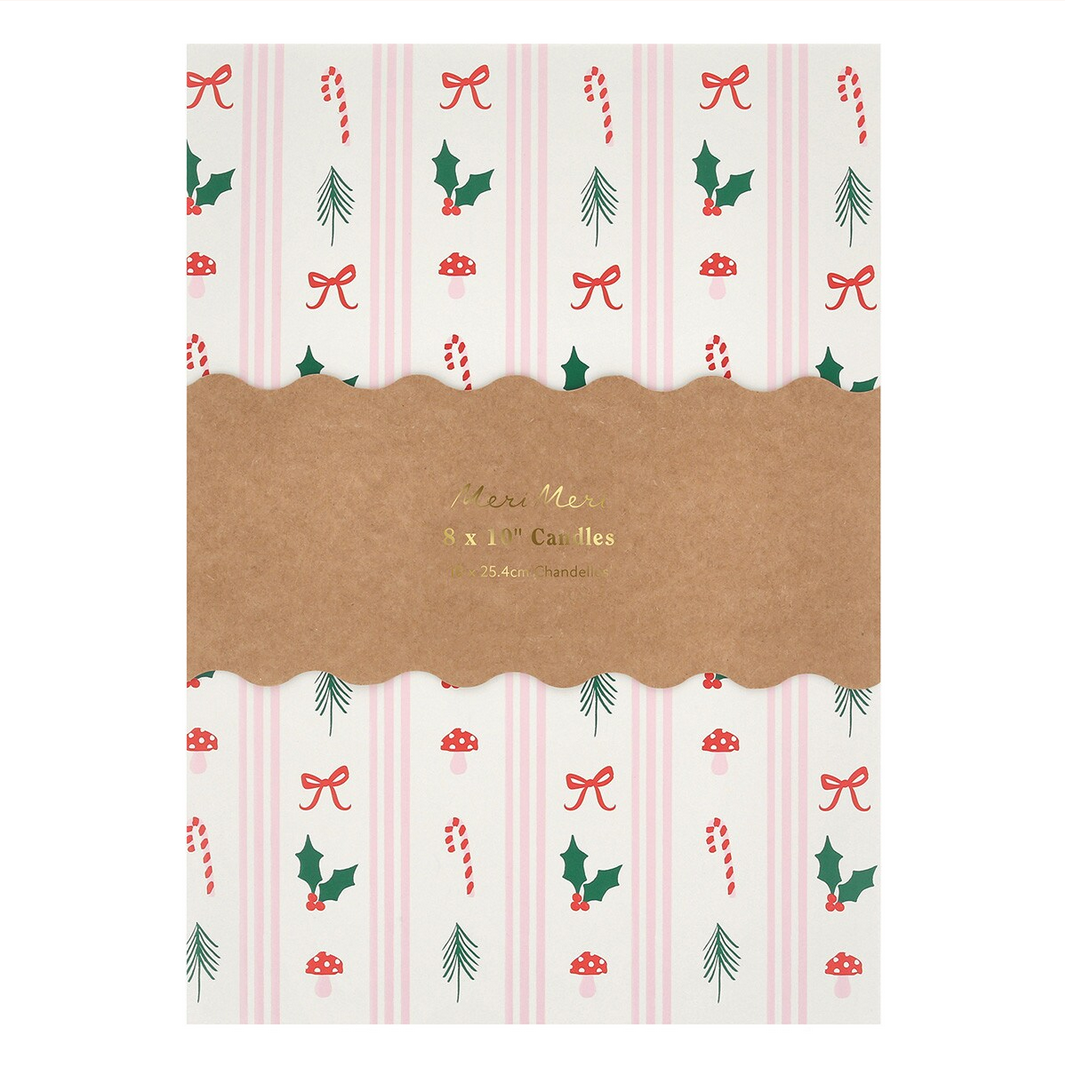 Packaging for candles with Christmas-themed design on a white background