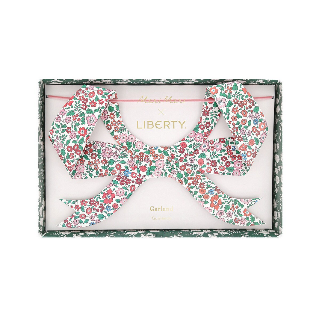 Two floral headbands in a Liberty of London box on a white background