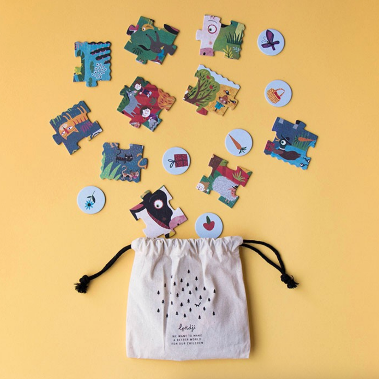 Colorful puzzle pieces and a drawstring bag on a yellow background