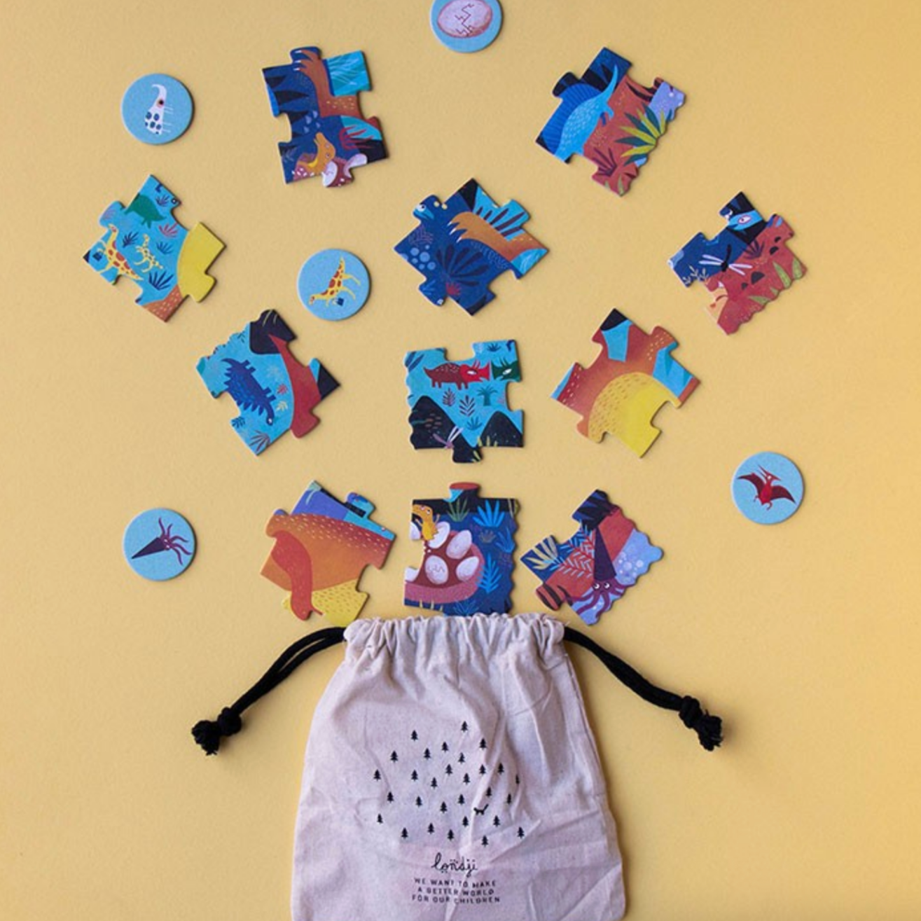 Colorful puzzle pieces shaped like a person on a yellow background with a drawstring bag.