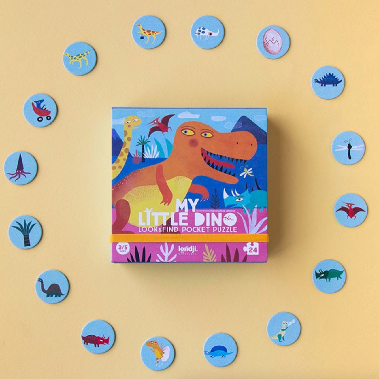 Children's puzzle box with dinosaur illustration on a beige background with scattered puzzle pieces.