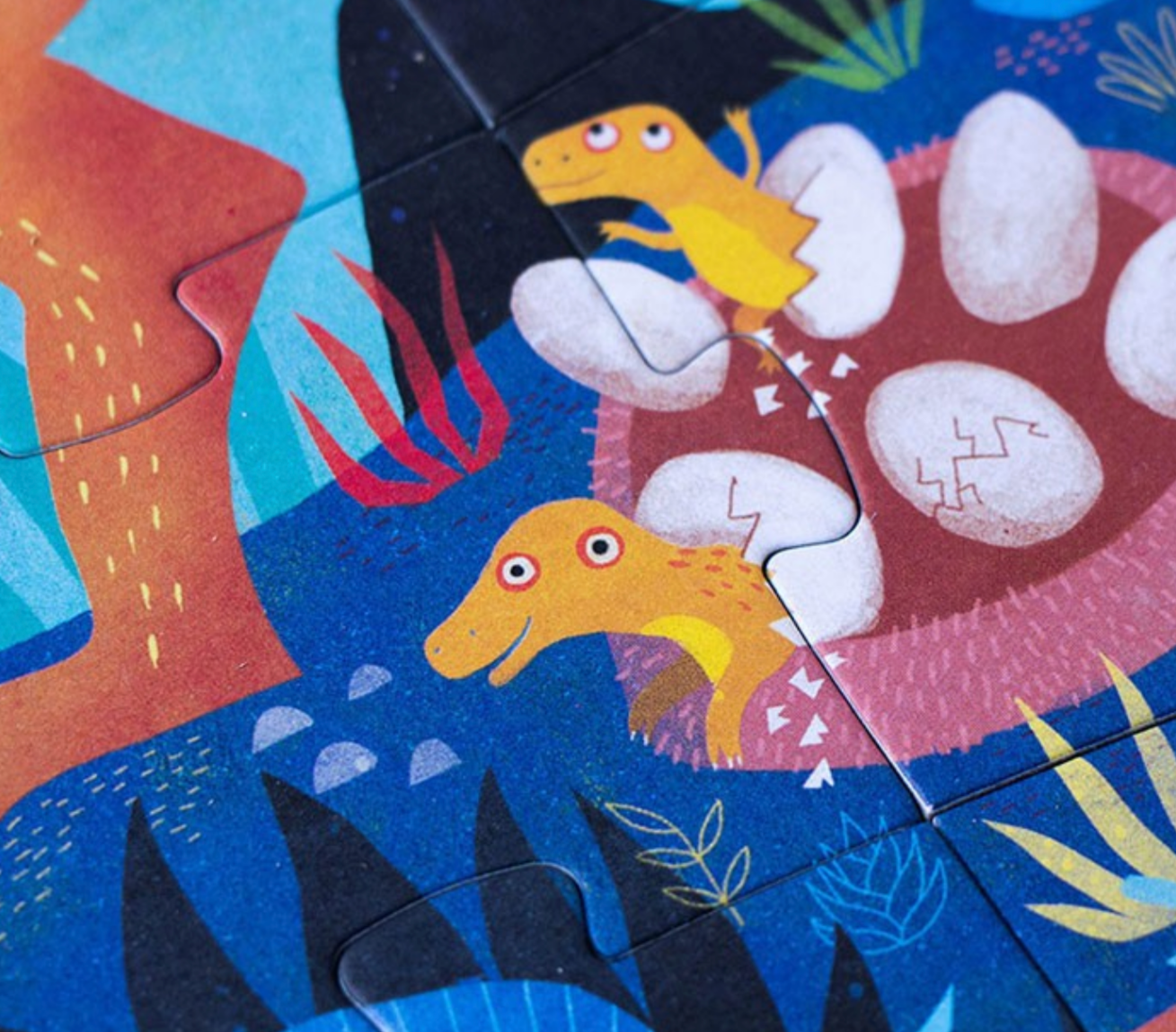 Children's puzzle with dinosaur design on a colorful background