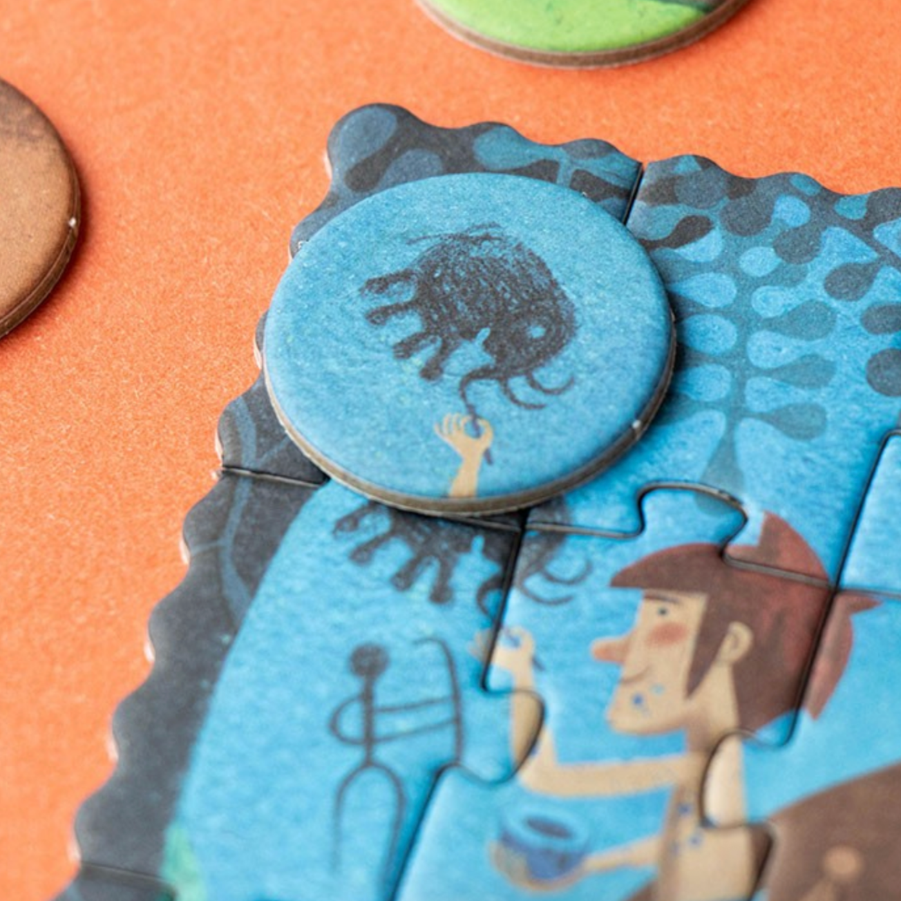 Close-up of a puzzle piece with a cartoon character and animal illustration on a colorful background.