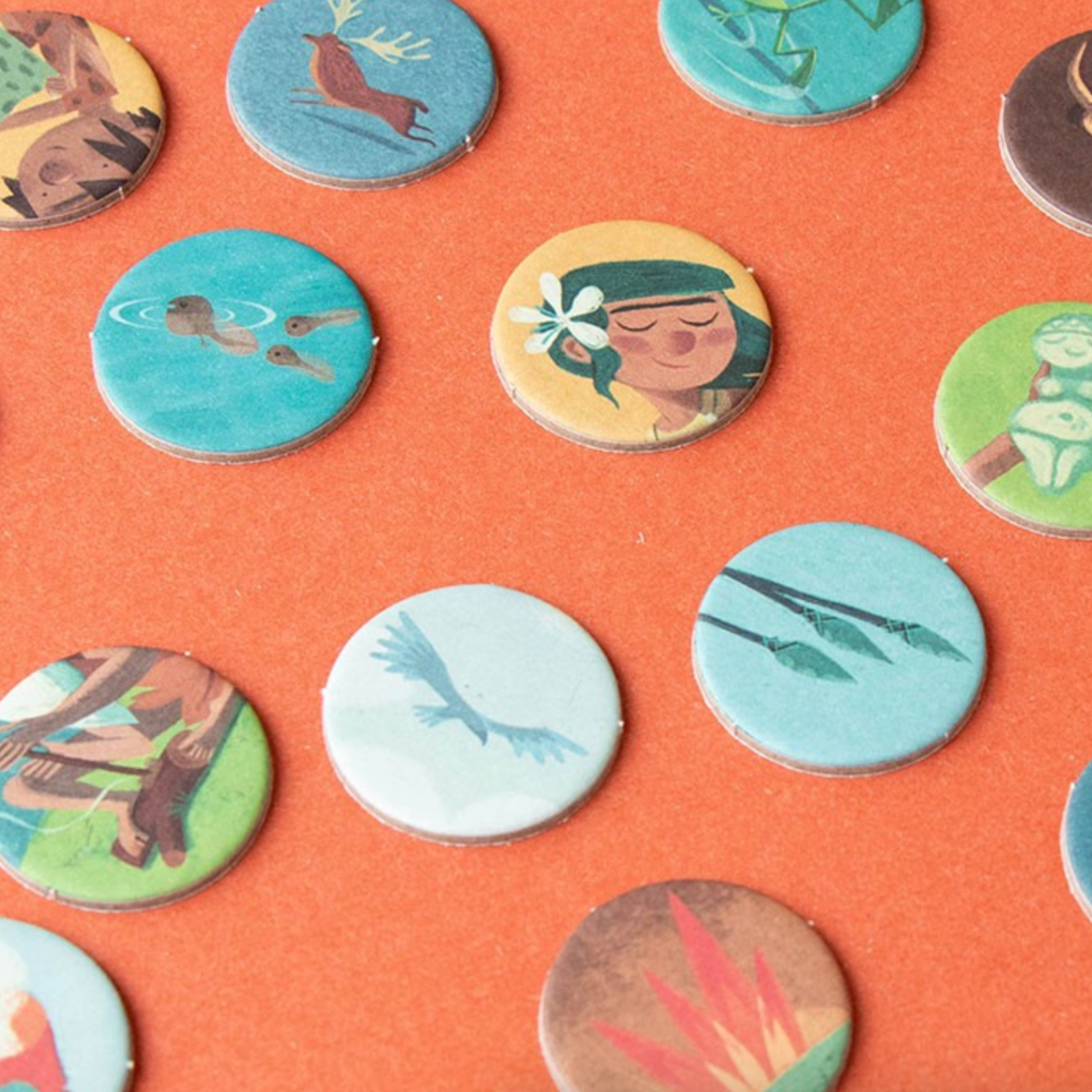 Collection of colorful buttons with various designs on an orange background