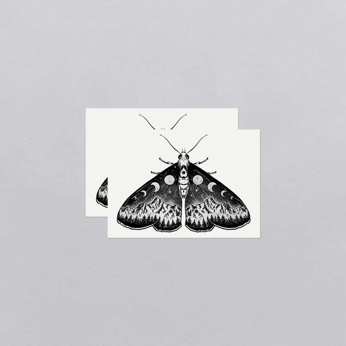 tattoo cards with black and white moth illustration on a gray background