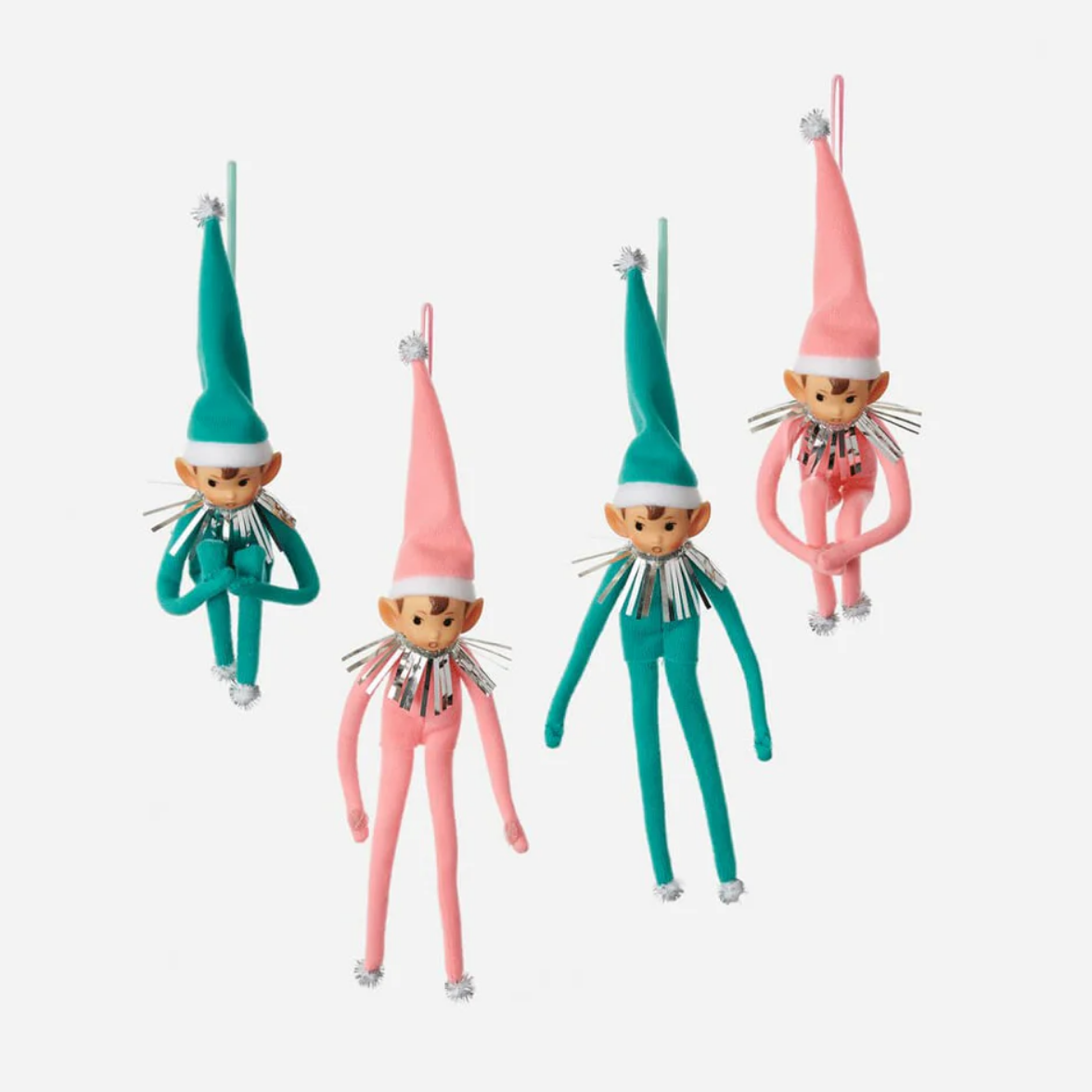Four colorful elf figurines on a white background