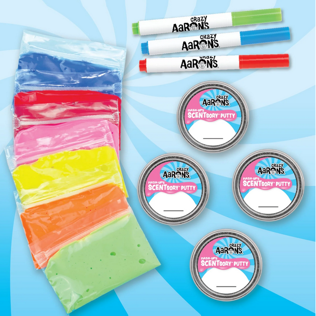 Colorful markers, putty, and circular tins with 'Arrows' branding on a blue background