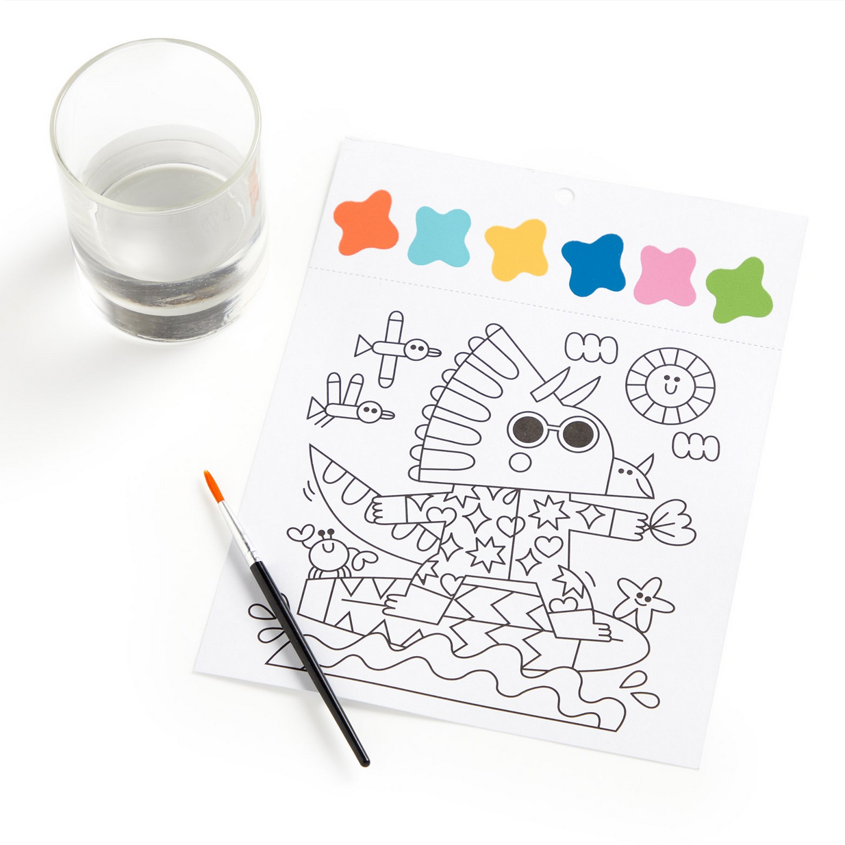 Coloring sheet with a dinosaur design, a glass of water, and a paintbrush on a white background.