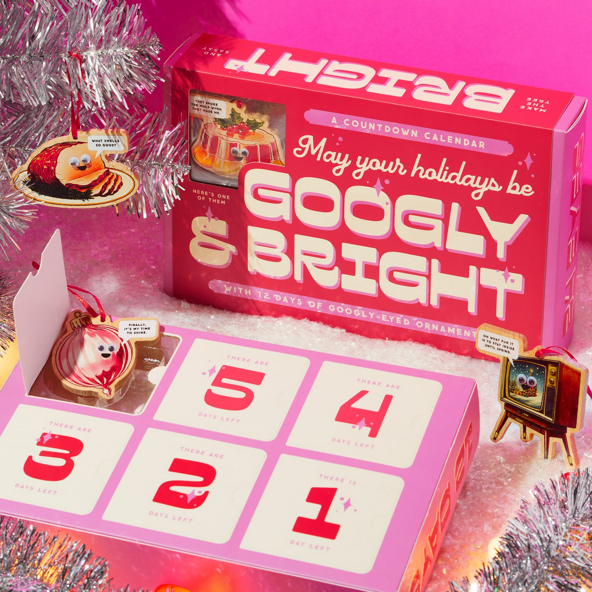 Pink advent calendar with 'May your holidays be Googly & Bright' text, surrounded by festive decorations.