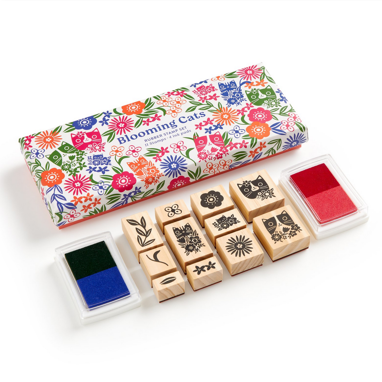 Set of wooden stamps with floral packaging and ink pads on a white background