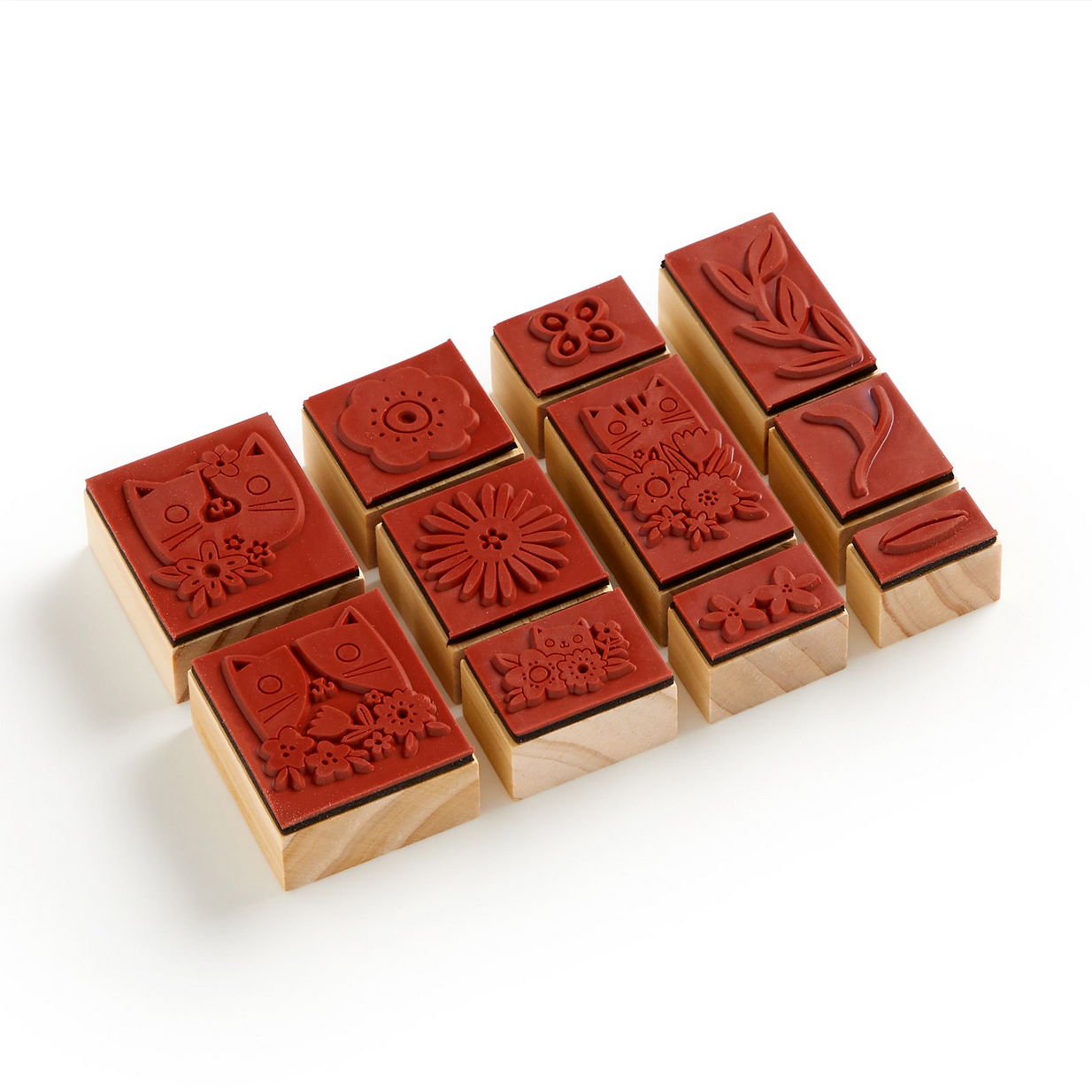 Set of wooden stamps with red ink pads on a white background
