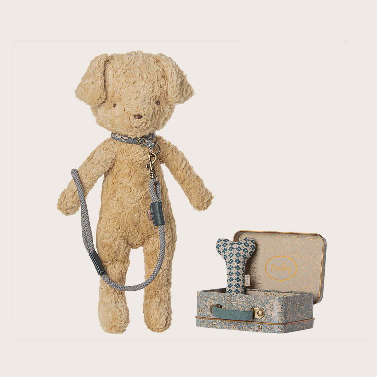 Beige teddy bear with accessories on a website page